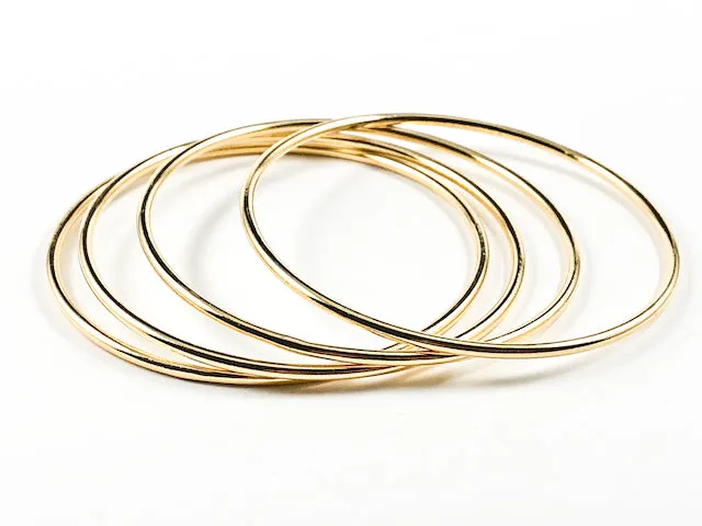 Beautiful Thin Shiny Metallic Style Gold Tone Set Of 4 Piece Brass Bangles