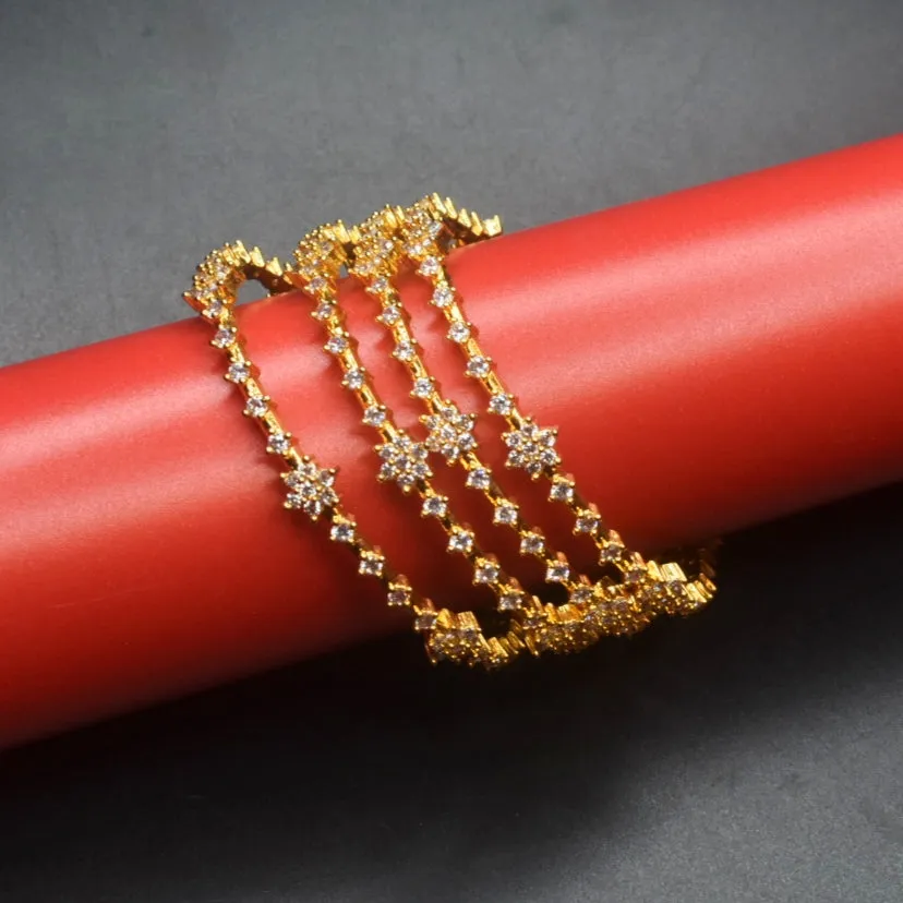 "Gilded Blooms: Stunning Gold-Plated CZ Bangles Adorned with Floral Motifs"