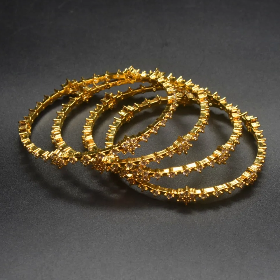 "Gilded Blooms: Stunning Gold-Plated CZ Bangles Adorned with Floral Motifs"